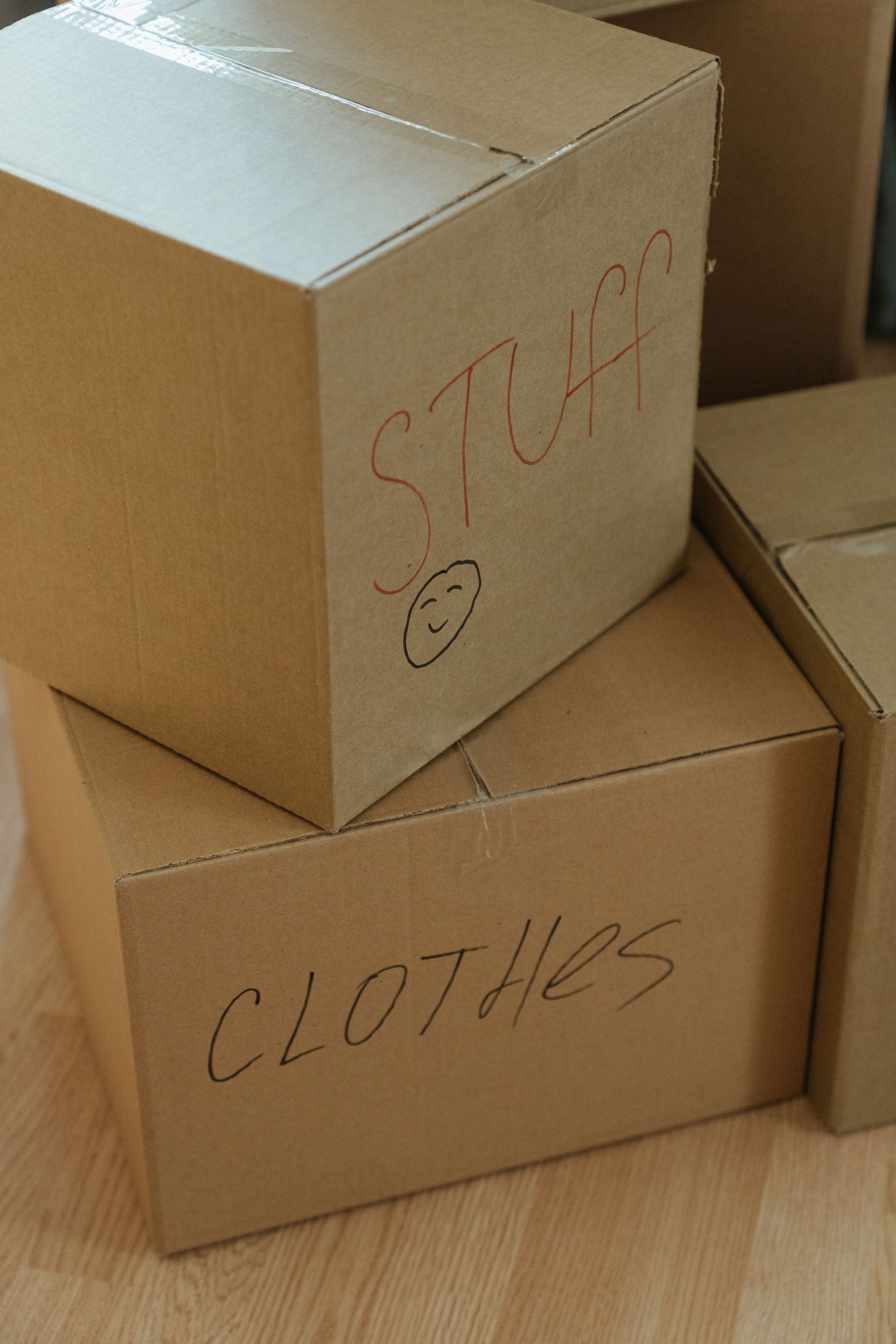 A collection of labeled cardboard boxes ready for moving day.